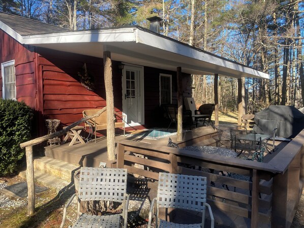 Cozy Cabin has a large covered & open deck to enjoy nature and the brook below!