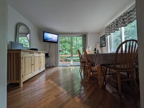 Bright dining area with direct porch access, ideal for meals with a view.