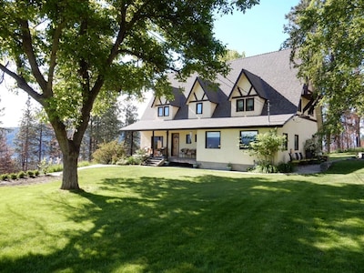 Quiet Country Tudor Home on Acreage with Incredible Lake and City Views