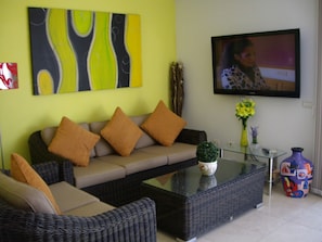 Relax in our Designer Lounge Area with 52' Flat Screen TV, DVD and iPod Dock for your Music
