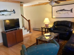 Living area with leather recliners and Dish TV