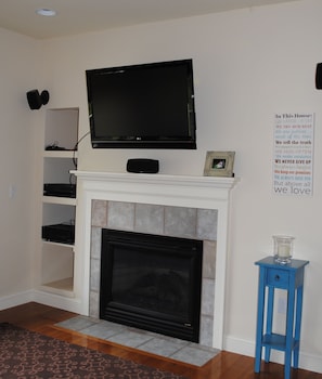 Family room comes with flat screen tv, cable, surround sound and gas fireplace.
