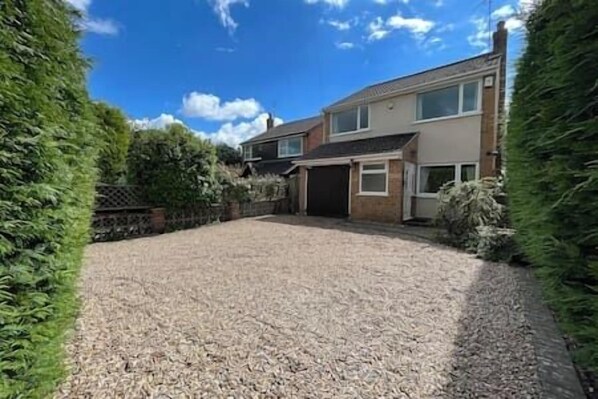 Large private drive, easily accommodates three cars