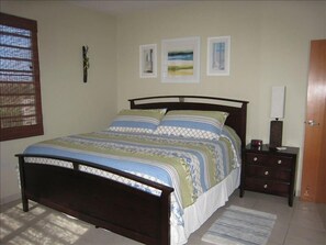 King size bed with A/C and ceiling fan