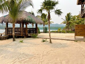 Beautiful sandy backyard with palapa and water entry steps...