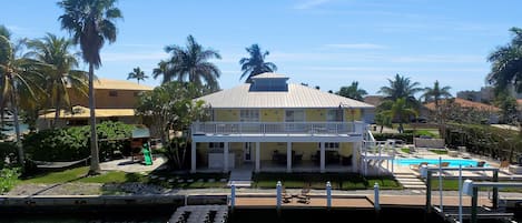 Rear view of Journey's End showing dock, playground, pool and upper/lower decks