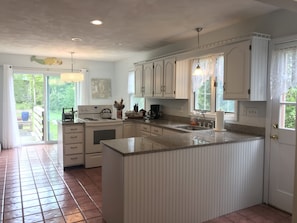 Fully equipped kitchen w/ Deck Acess.