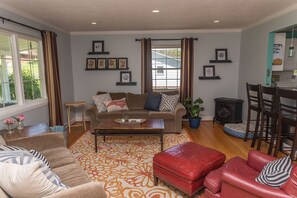 Comfortable main level living room open to the kitchen and dining area.