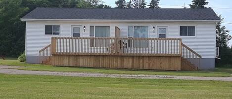 Here are the updated Deluxe Duplex Cottages, with new doors, deck with privacy wall, roof, siding, and rear windows.