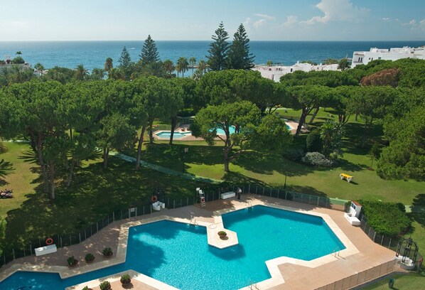 Partial aerial view of Club Playas Del Duque gardens and beach. 