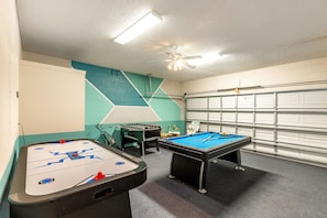 Games Room with pool table, air hockey and foosball table