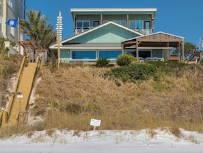 East of the Sun Sits on Bluff Overlooking Beach