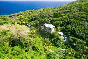 Aerial view of home and guest house to keyhole beach. Nice neighbors too.