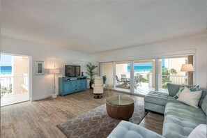 Living area leads to oversized, private balcony/patio with Gulf view