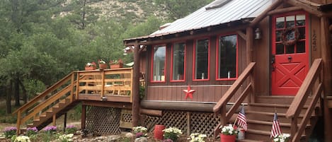 Welcome to our country cabin w/ views galore from wrap around deck & sunroom.