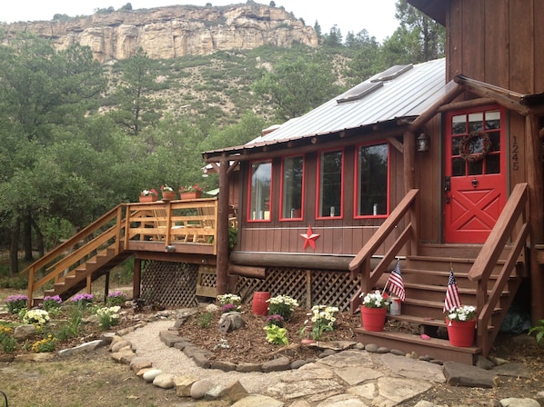 Welcome to our country cabin w/ views galore from wrap around deck & sunroom.