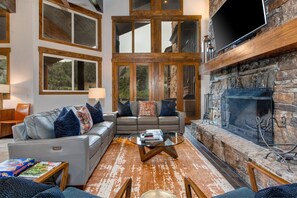 Living Room with Comfortable Mountain Contemporary Furnishings, Warm Fireplace, and TV