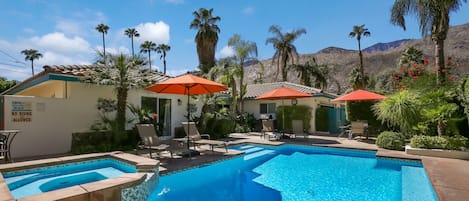 View of pool and house from corner of yard