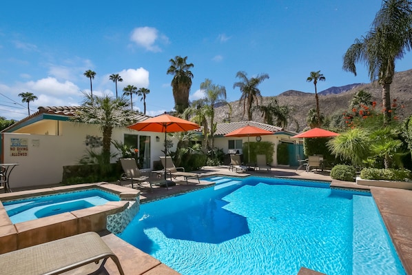 View of pool and house from corner of yard