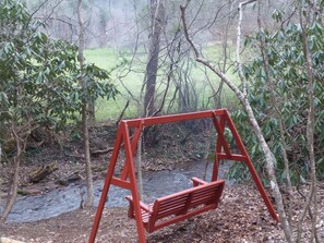 Creekside swing allows you to relax and unwind. Listen to the babbling creek.
