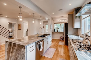 Kitchen flows from the entry to the back yard