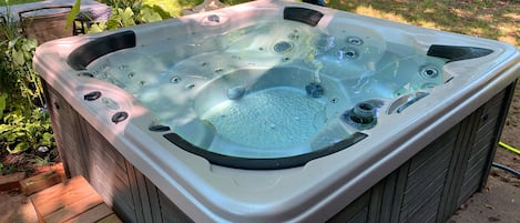 Backyard Hot Tub and sitting area