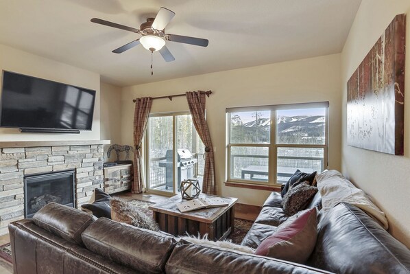 Main Living Area with Large Sectional Couch, TV, and Fireplace