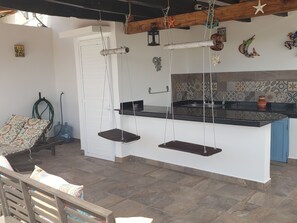 Enjoy libations at the wet bar w/2 swings on our  private rooftop terrace.