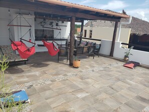 Rooftop terrace is exclusive to our Unit only, with two swings at the wet bar. 