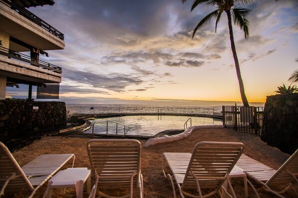 lounge on the sand beach by the Salt water pool.
