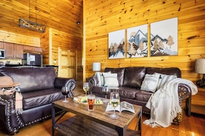 Cozy living room with six seater leather sofa.