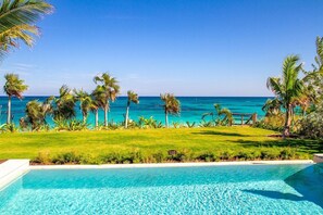 Wild Orchid's ocean-view private pool and yard overlooking the beach.