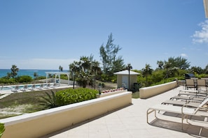 Large patio overlooking the pool and ocean