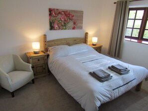 Master bedroom featuring black out curtains, TV, dressing table, double wardrobe