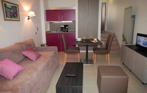 Prepare meals in the kitchenette and enjoy them at the dining table.