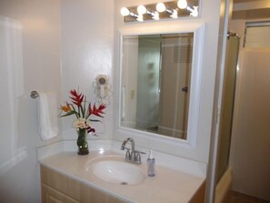 Beautiful bathroom with charming vanity, shower & mini-tub