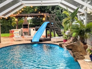 Heated Pool w/ Water Slide, Outdoor Kitchen, with Brazilian BBQ & Smoker.