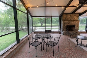 Dining on the porch overlooking the garden.