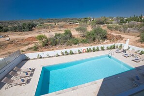 View of the pool from the upstairs veranda