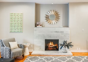 Marble fireplace & accent lights set the tone for this cool comfortable retreat