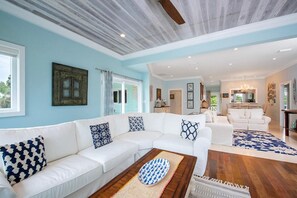 Living Area has an open concept with 2 comfortable sofas surrounding a large screen TV with cable and WIFI in the family room.