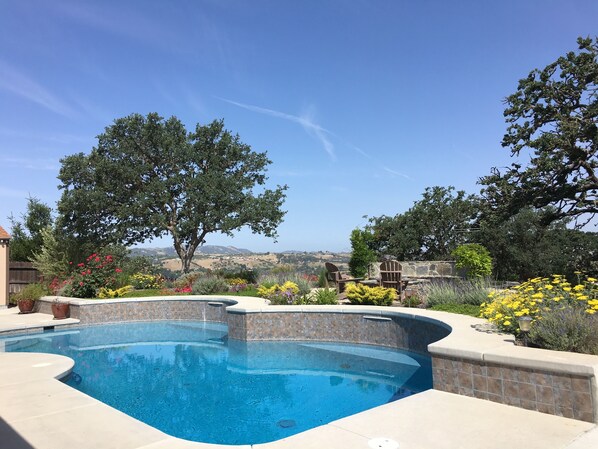 Beautiful swimming pool surrounded by gorgeous landscaping!