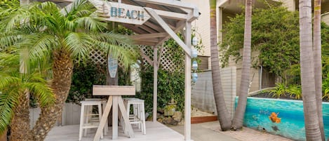 Large Patio with Dining for 8 in the pergola.