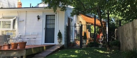 Inspired guest paints in sunlit covered patio with clear roofing. 