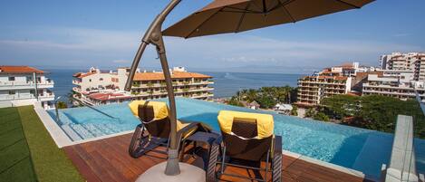 Lounge poolside with ocean views