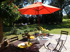 Table, Plant, Furniture, Property, Umbrella, Tree, Chair, Shade, Outdoor Table, Outdoor Furniture
