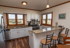 Spacious upgraded kitchen to entertain, prepare a meal, or enjoy a sunset.