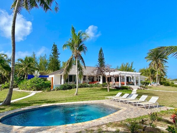 Private beachfront estate, On the Rocks, located on a mile-long pink-sand beach.