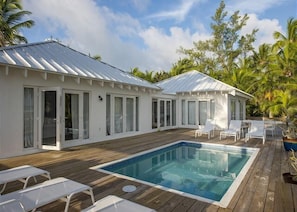 Enormous deck facing the beach with outdoor dining and seating