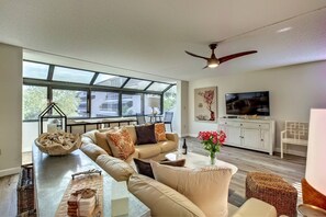 Beautifully updated living room with large high-end leather corner sofa.